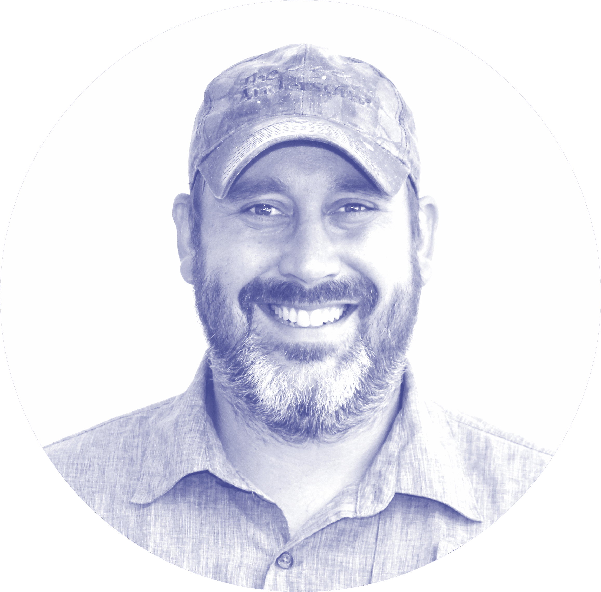 a man wearing a hat and smiling at the camera